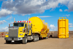 Yellow Transport With Oilfield Tanks